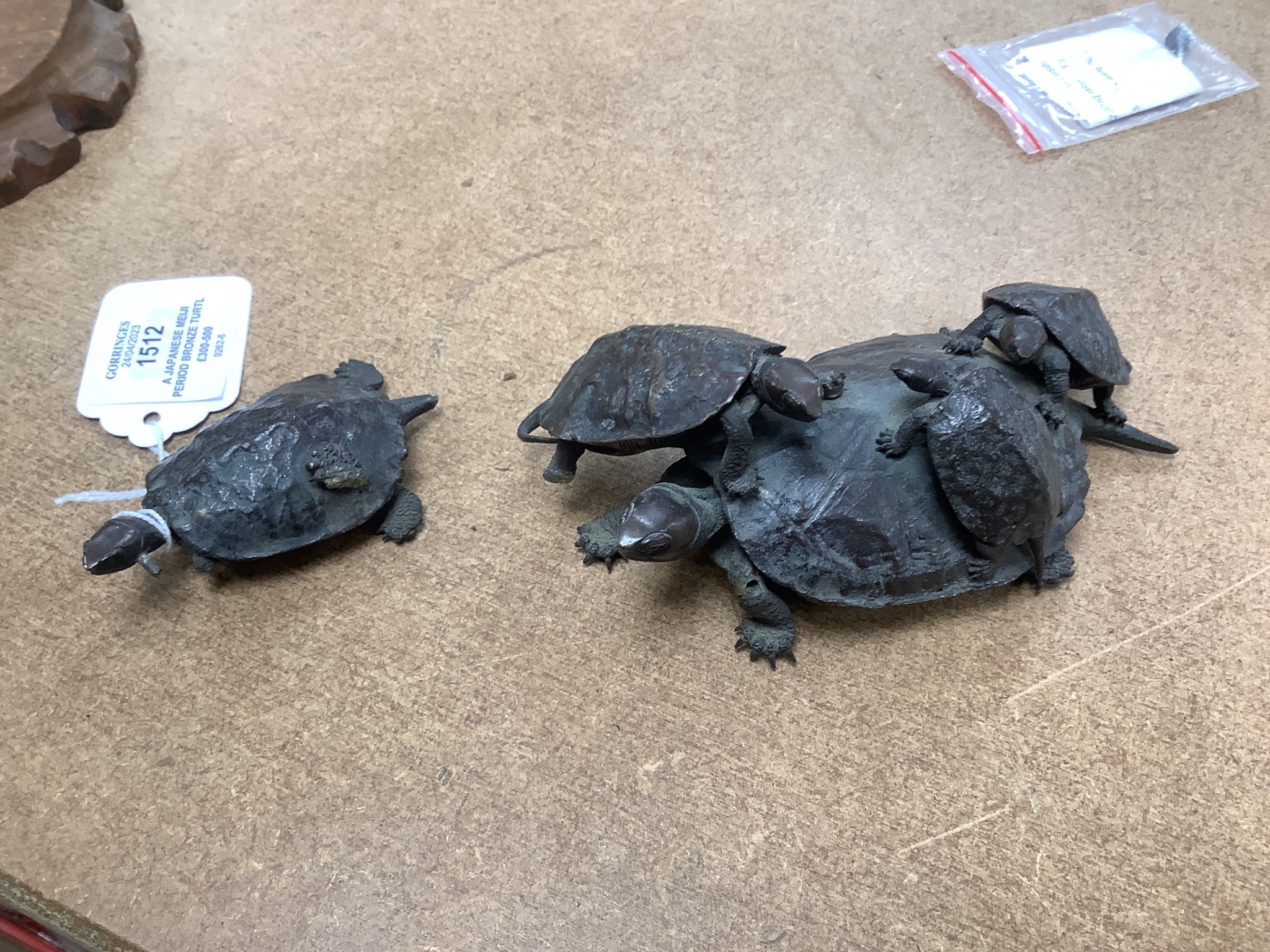 A Japanese Meiji period bronze turtle group, signed to base, (a.f.), 16cm wide